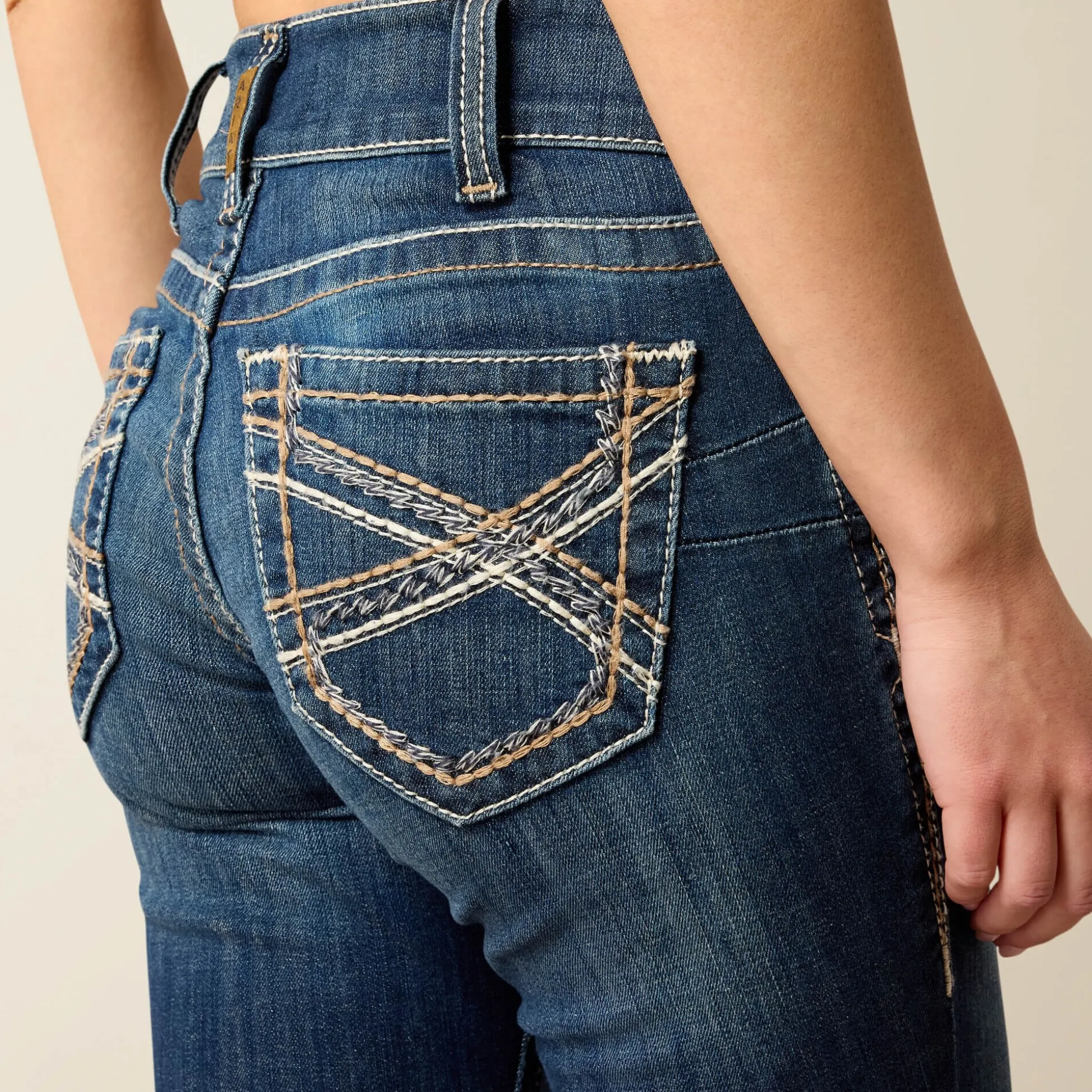 R.E.A.L. Mid Rise Stretch Entwined Festival Boot Cut Jean